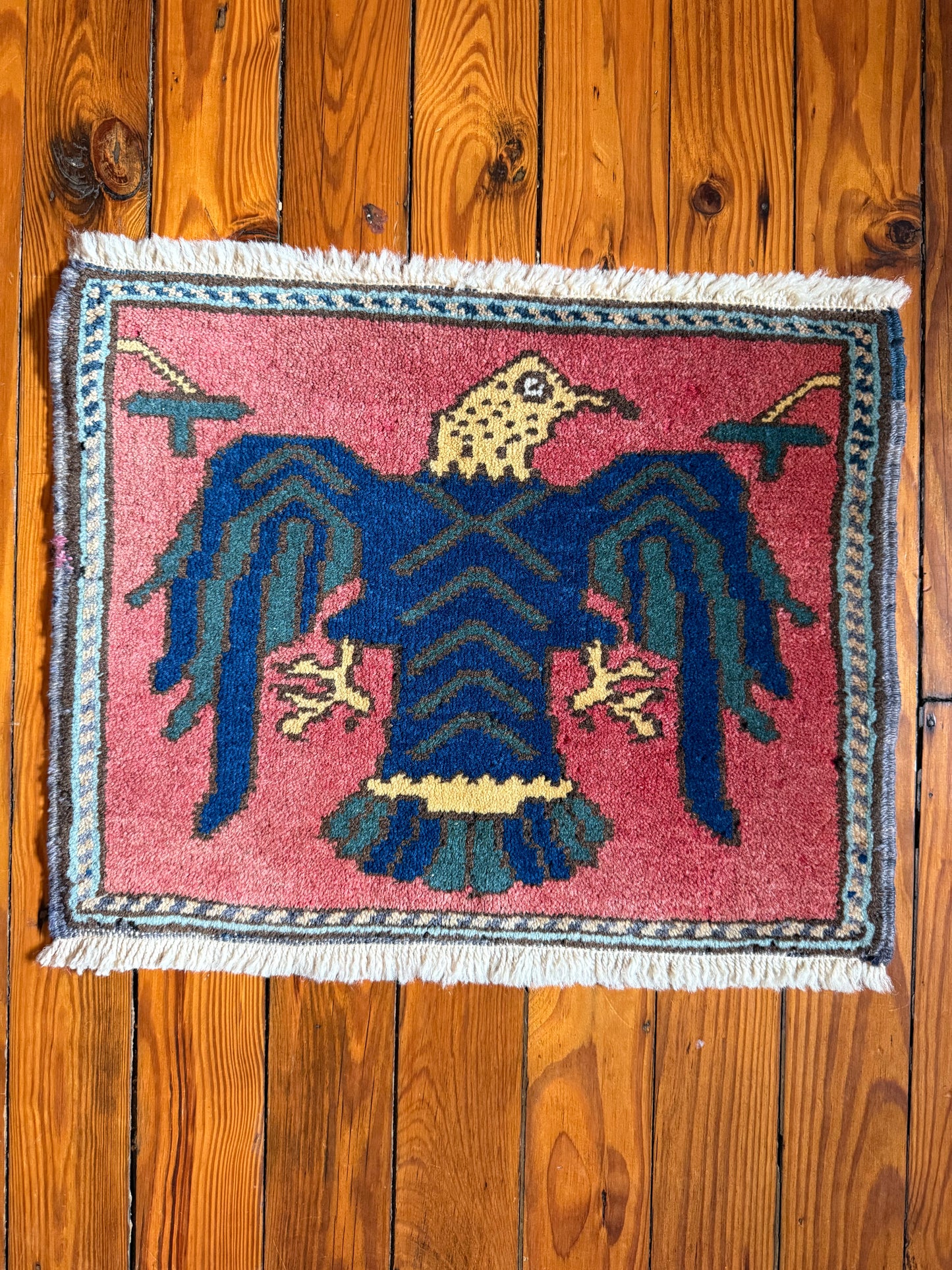 Kartal rug, in traditional style, featuring geometric; animal pattern, with nan pile